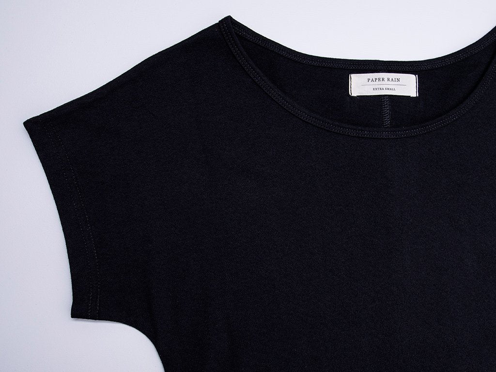 Close up of sleeve and neck of Women's Plain Tailor T-shirt in Black. A simple, fair-trade, organic cotton t-shirt.